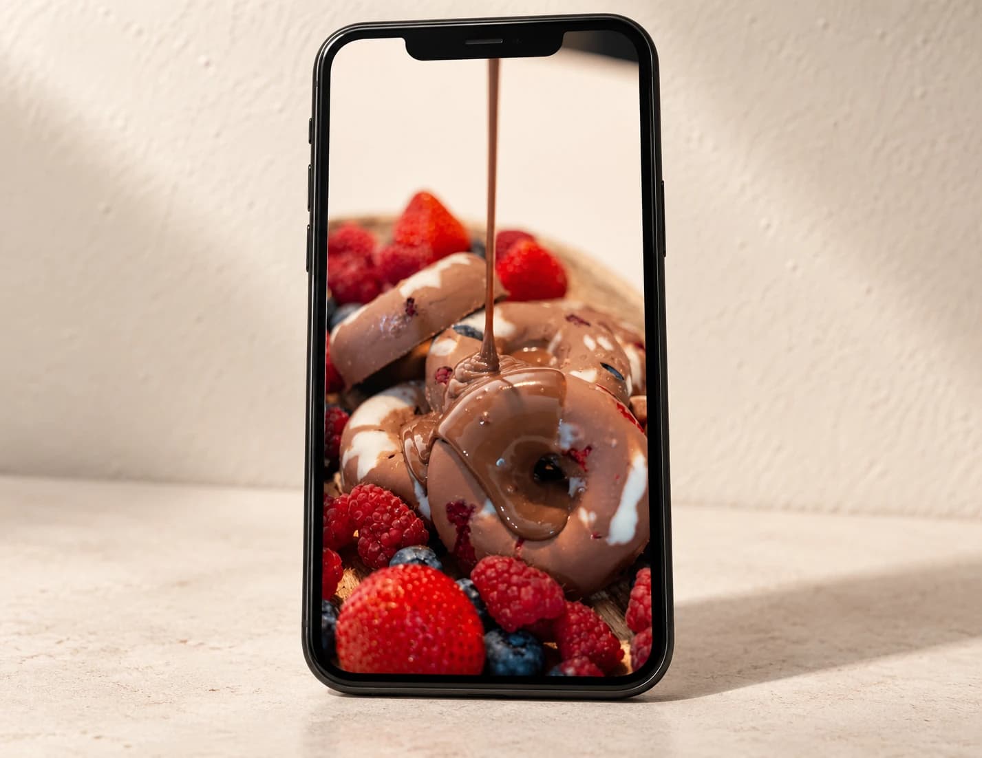 Aseer Time campaign photography displayed on a phone in an editorial mockup