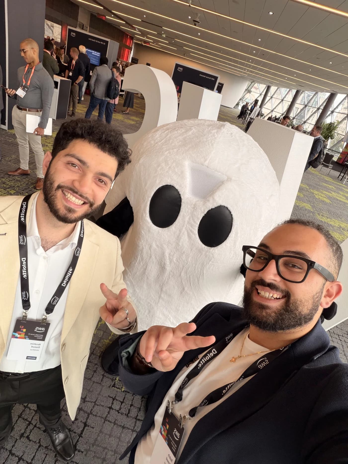 WebRise founders at a conference with an event mascot
